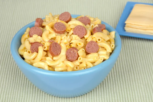 Macaroni and cheese with sliced hotdogs