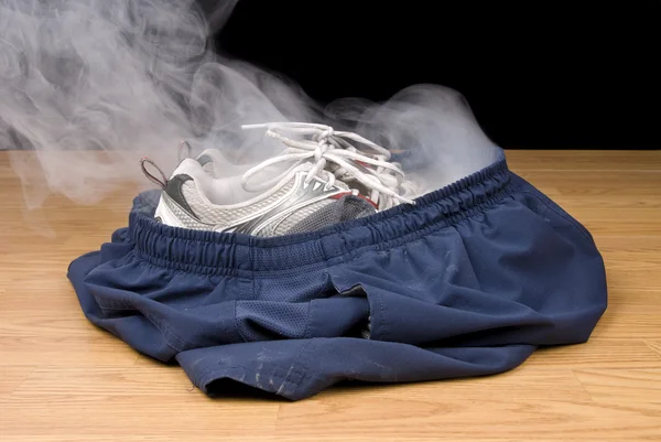 Smoking shorts and tennis shoes — Stock Photo, Image