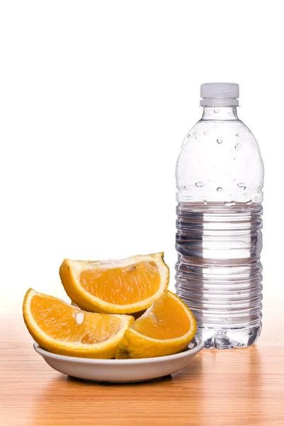Fresh fruit and bottled water — Stock Photo, Image