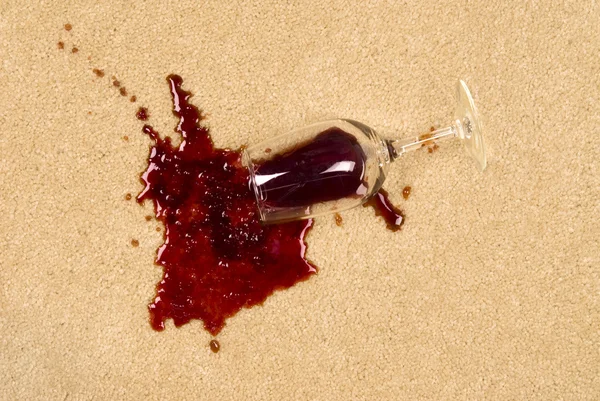 Spilled wine on carpet — Stock Photo, Image