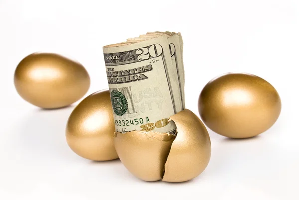 Hatched golden egg with cash — Stock Photo, Image