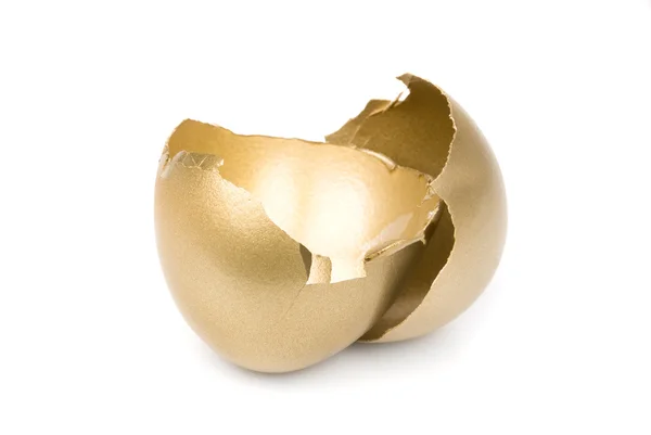 Złamane złote jajko — Zdjęcie stockowe
