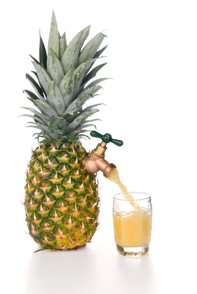 Pineapple juice pouring into glass — Stock Photo, Image