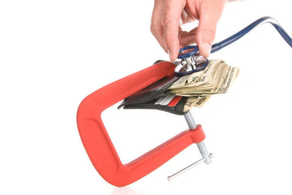 Clamped wallet examined with stethoscope — Stock Photo, Image