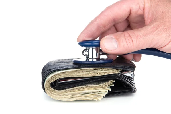 Wallet with cash eing examined with stethoscope. — Stock Photo, Image