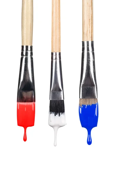 Dripping paint brushes — Stock Photo, Image