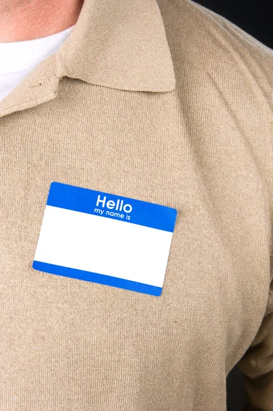 Businessman with a blank nametag — Stock Photo, Image