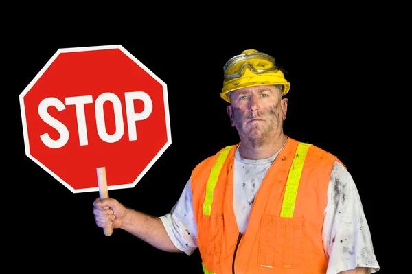 Obrero de la construcción sosteniendo stop signo — Foto de Stock