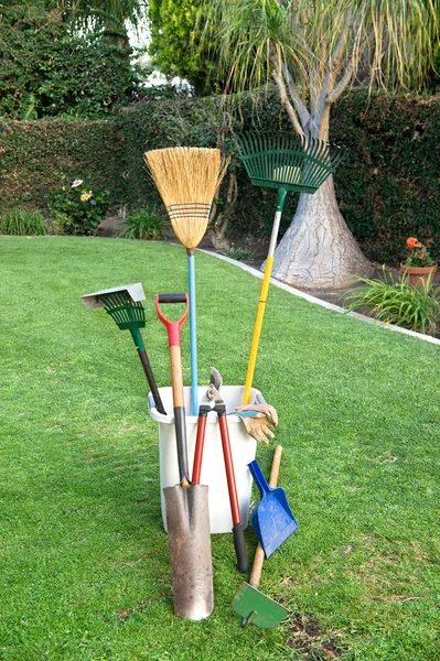 Gardening tools on grass — Stock Photo, Image