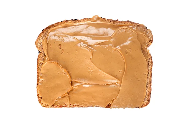 Fatia de pão com manteiga de amendoim — Fotografia de Stock