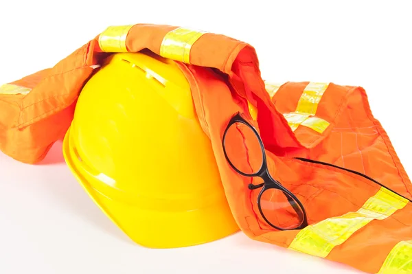 Hard hat and safety vest — Stock Photo, Image