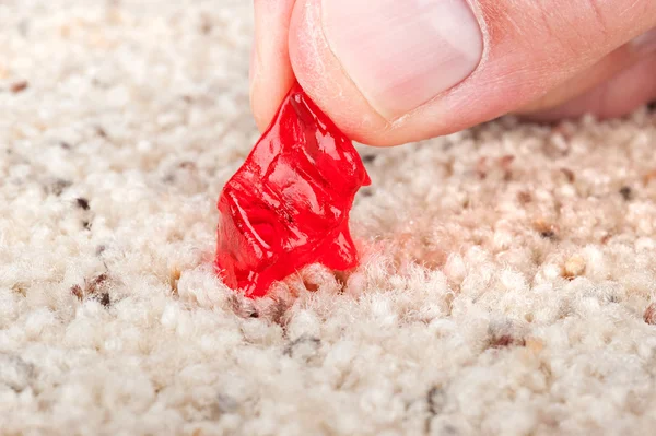 Candy stuck on carpet — Stock Photo, Image