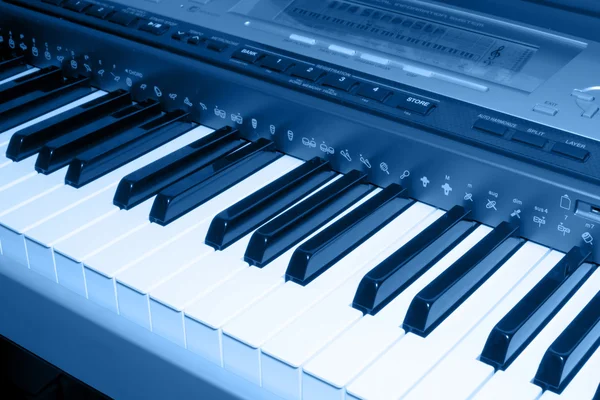 Colored blue photo of electronic piano