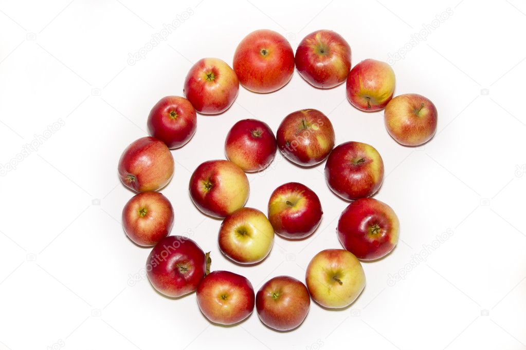 Spiral form of red apples isolated on white