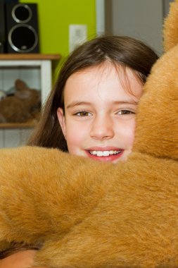 Happy girl with teddy bear clipart