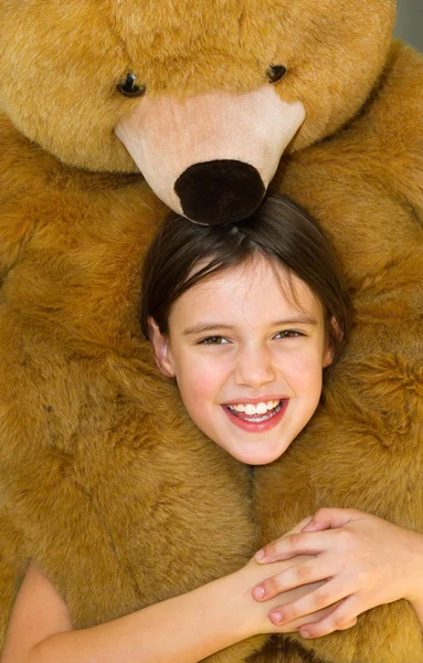 Happy girl with teddy bear — Stock Photo, Image