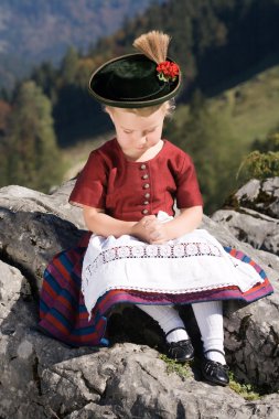 Little girls in Bavarian pray clipart
