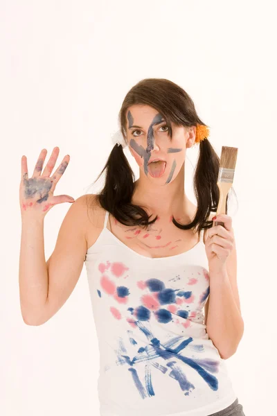 Jeune femme avec de la peinture sur le visage — Photo