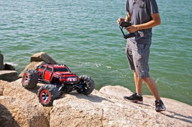 RC toy car on a rock terrain clipart