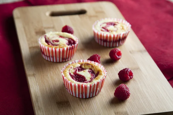 Three raspberry cheesecakes — Stock Photo, Image