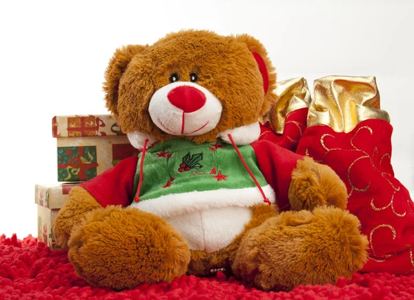 Vánoční medvěd sedící s dárky Stock Fotografie
