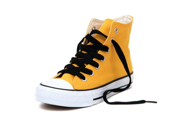Stylowe sneaker żółty z czarnym latchet — Zdjęcie stockowe