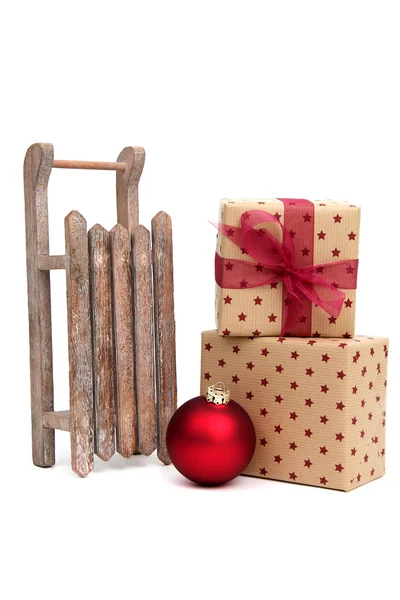 Old wooden sledge with christmas presents on white — Stock Photo, Image