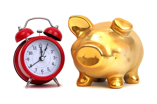 Alarm bell and golden piggy bank — Stock Photo, Image