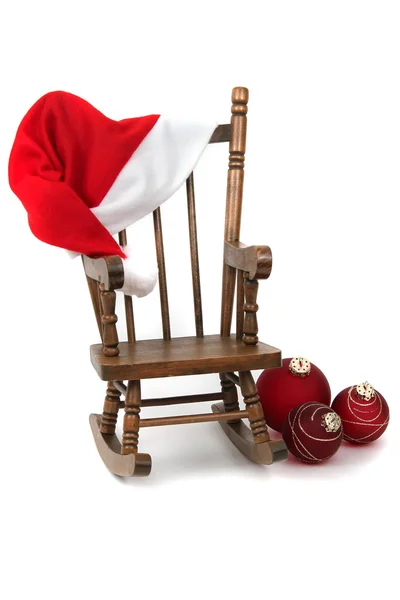 Cadeira de balanço de madeira velha com tampa de saco de geleia vermelha — Fotografia de Stock