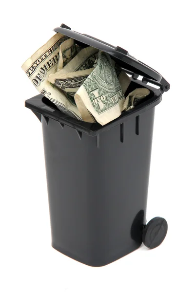 Dollar notes in black rubbish bin on white — Stock Photo, Image