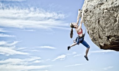 Female rock climber. clipart