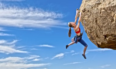 Female rock climber. clipart