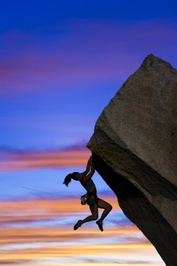 Female rock climber. clipart