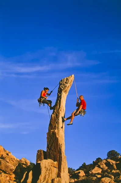 Rock climbing team rappelling. — Stock Photo, Image