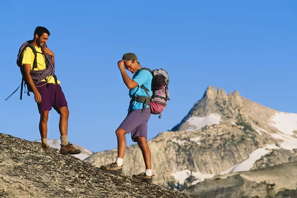 Rock climbing team reaching the summit. — Stock Photo, Image