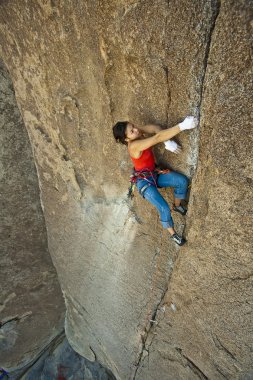 Female rock climber. clipart