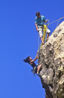 Team of rock climbers. clipart