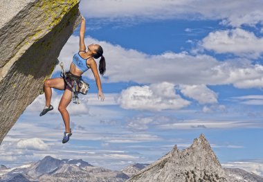 Female rock climber. clipart