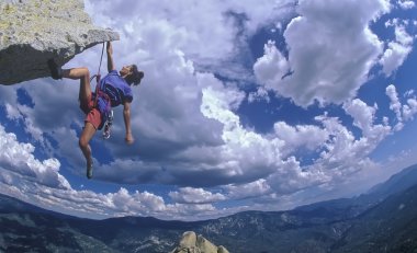 Female rock climber. clipart