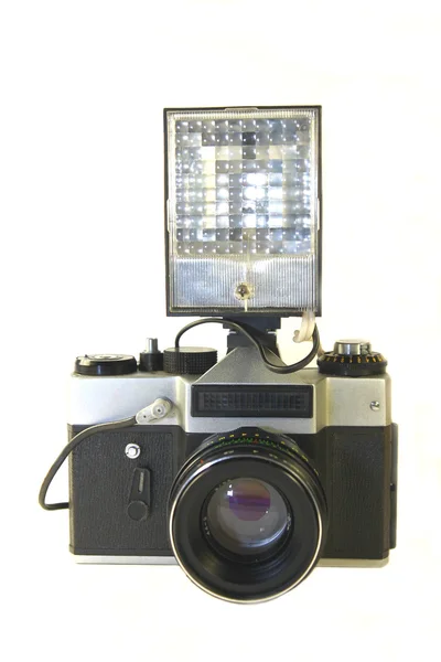 Eski beyaz zemin üzerine izole kamera flash — Stok fotoğraf
