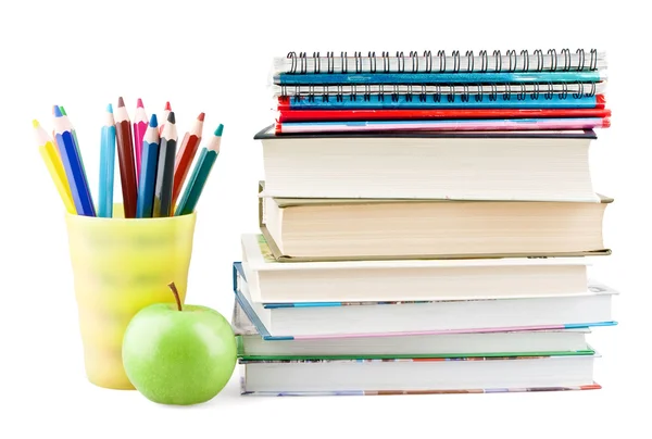 Kleurpotloden in pot met schoolboeken en apple — Stockfoto