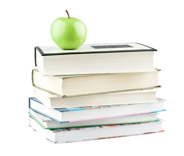 Zelené jablko na učebnice — Stock fotografie