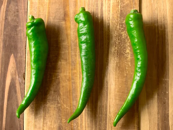 Green chilies on table — Stock Photo, Image