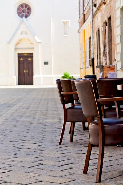 stock image Chairs on the narrow street in old town