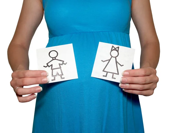 stock image The pregnant woman holds drawings of the girl and the boy