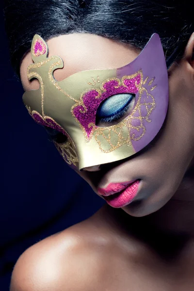 Beauty portrait of a young black woman wearing mask — Stock Photo, Image