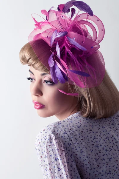 Beautiful fashion model wearing a fancy hat, isolated on white — Stock Photo, Image