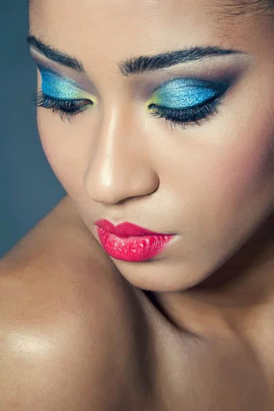 Beautiful young woman with colorful makeup — Stock Photo, Image
