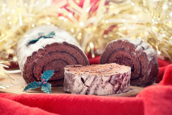 Čokoládové vánoční poleno posypaná moučkovým cukrem — Stock fotografie