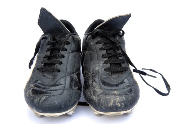 stock image Dirty black leather football soccer boots isolated on white